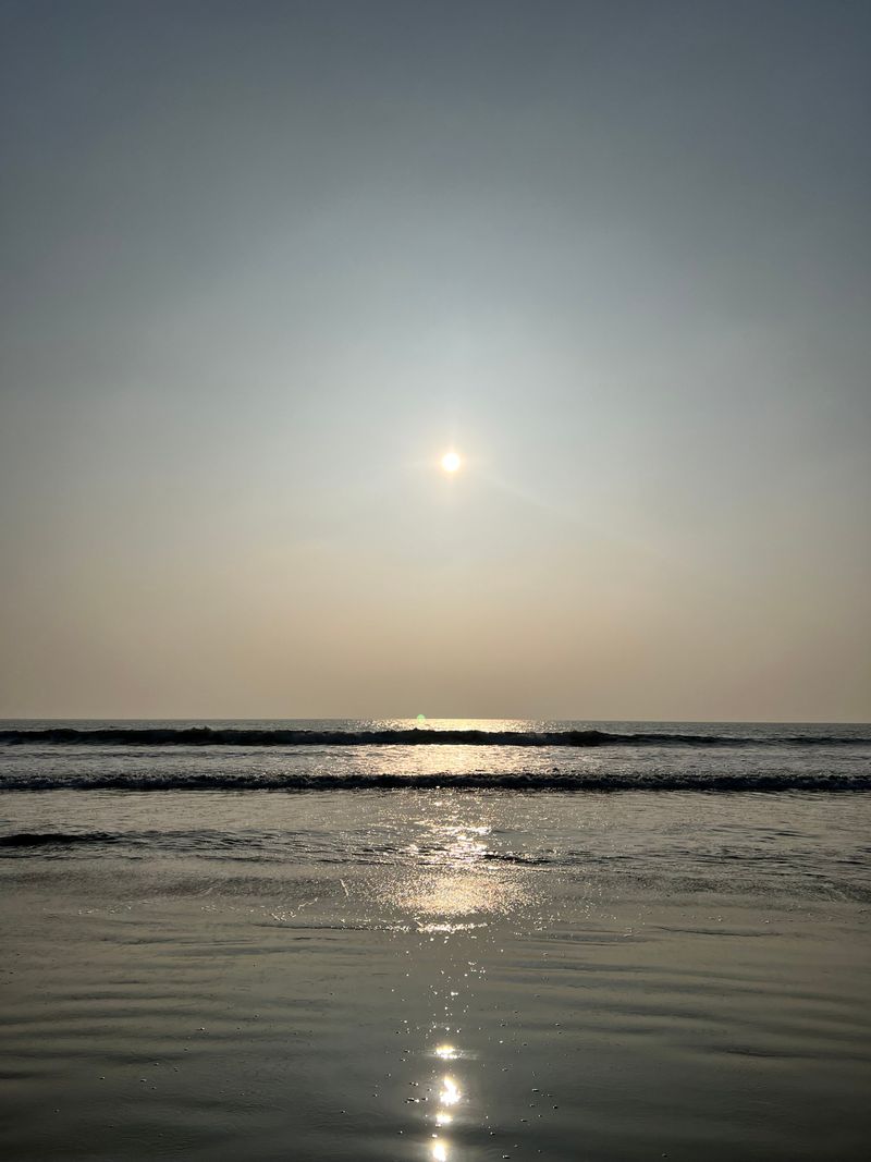 Sunlight casting a silver path across the ocean