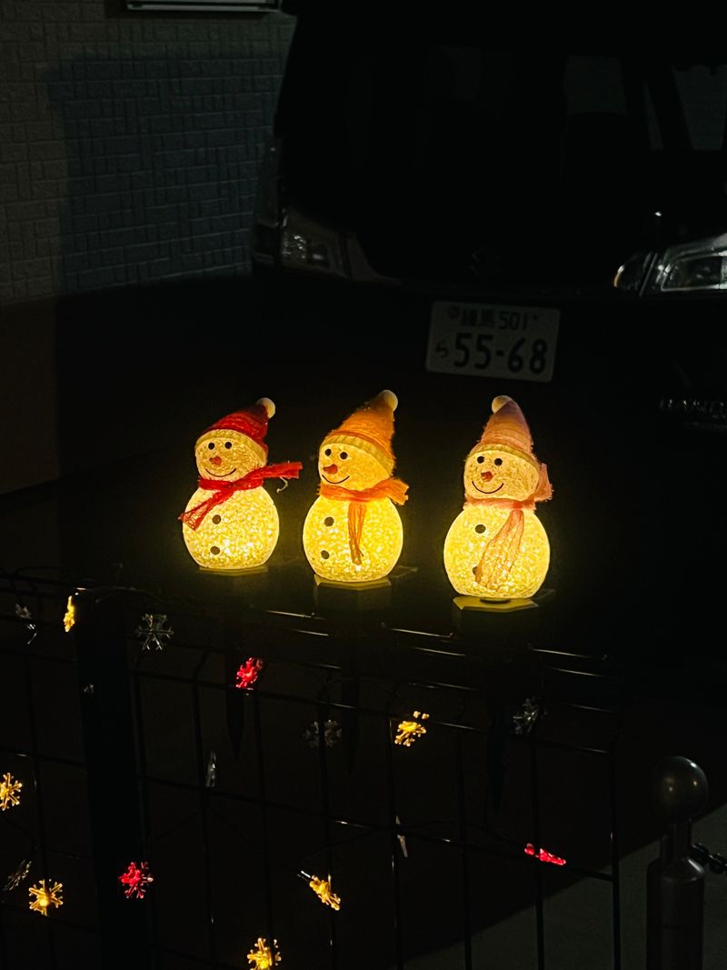 Three glowing chick lanterns lighting up the night